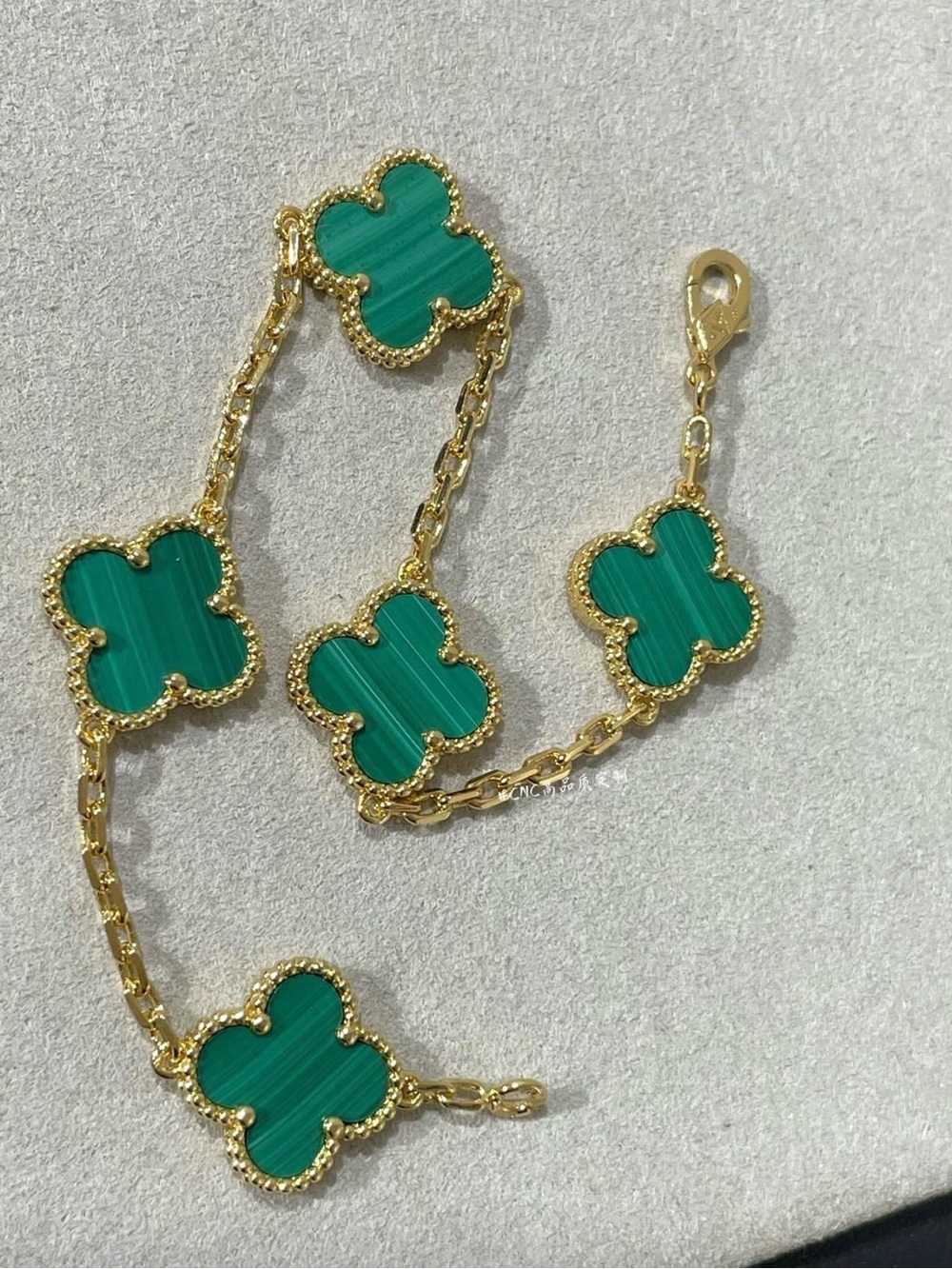 Gold-Plated Clover Link Bracelet with Green Inlays